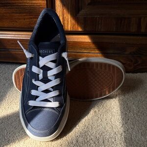 Skechers women’s Dark Blue and White Sneakers